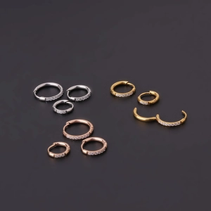 Polished stainless steel hoop earrings with cubic zirconia in silver, gold, and rose gold