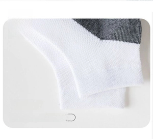 Close-up of elastic ribbed cuff on breathable white cotton school socks for children