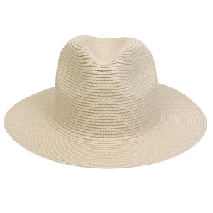 Detailed weave pattern of a beige straw fedora hat featuring a classic sun shade brim