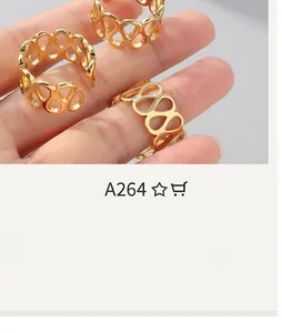 Detail of adjustable gold-plated teardrop hollow pattern rings worn on fingers