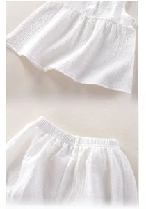Close-up of white double-layer cotton gauze fabric texture and elastic waistband detail