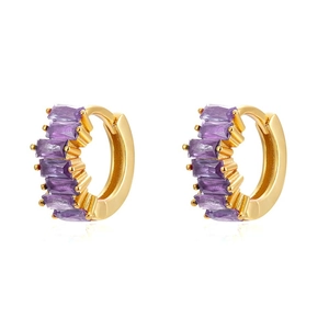Macro view of gold huggie earrings featuring five prong-set purple rectangular zircons