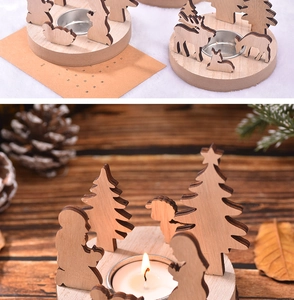 Détail du bougeoir de Noël en bois avec silhouette de renne et plateau en métal pour bougie