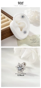 Macro detail of snowflake stud earring with secure screw-back closure and 0.96cm size marking