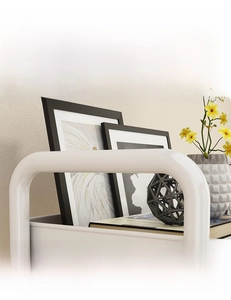 Ergonomic U-shaped handle and top tray detail of a multi-tier white rolling cart
