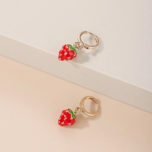 Sweet red strawberry drop earrings with gold hoops displayed on white steps