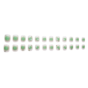 Green gradient press-on nails set with star patterns and small rhinestones on white background