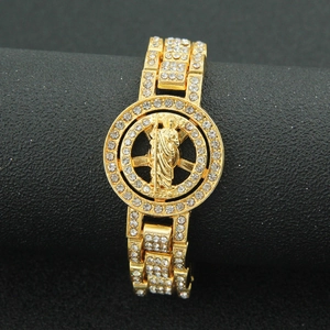 Iced out gold Cuban link bracelet with a religious figure medallion for hip hop fashion wear