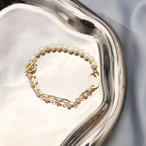 Asymmetric natural pearl and amethyst bracelet with layered gold-plated chains and OT clasp