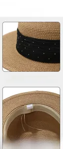 Detail view of straw hat with rhinestone band, sweatband, and adjustable 57cm inner cord