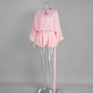 Detail of pink chiffon set with pleated bubble sleeves and lace-up neckline