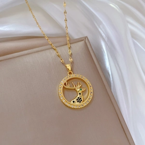 Luxury gold deer necklace with sparkling crystals and a circular hollow pendant