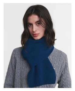 Detail shot of navy blue wool knit scarf showing fine ribbed edge texture and premium weave