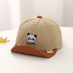Close-up of baby panda cap featuring embroidered details and soft color-block texture