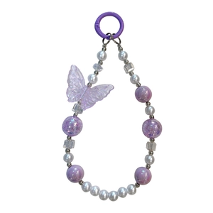 Luminous purple butterfly beaded phone charm and keychain with iridescent pearls.