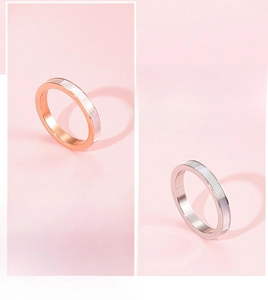 Detailed close-up of 3mm titanium steel rings in rose gold and silver with shell inlay
