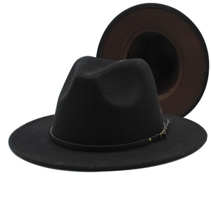 Close-up of black and brown wool fedora hat with a thin leather belt and gold buckle