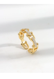 Macro shot of gold-plated chain ring with micro-pave crystals and adjustable open band