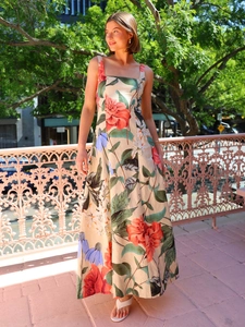 Detail view of floral print maxi dress featuring square neckline and linen texture