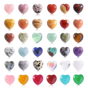 Macro display of diverse 15mm heart-shaped natural crystal stones in colorful grid layout