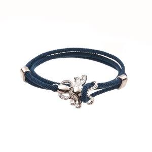 Deep blue nautical rope bracelet with silver anchor clasp on a clean white background