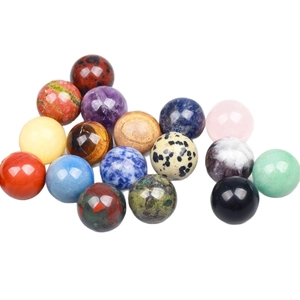 Polished natural crystal sphere set featuring amethyst, tiger eye, and red agate gemstones