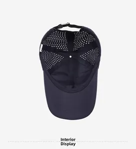 Interior details of blue baseball cap showing breathable laser cut holes and adjustable strap