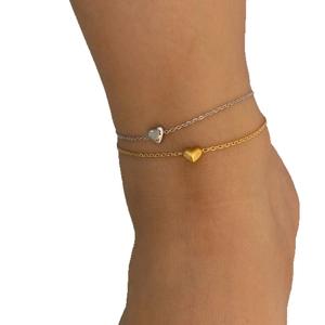 Minimalist gold and silver heart anklet set for women on clean white background