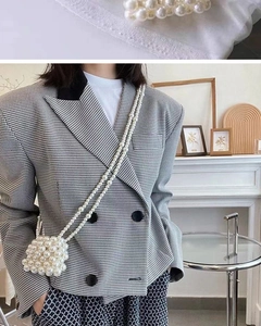 Detail of handmade cream pearl beaded mini crossbody bag with matching shoulder strap
