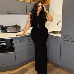 Detail of elegant black halter dress with slim fit fishtail cut and deep V-neckline