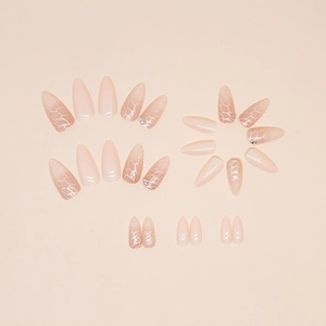 Glitter almond press-on nails with silver leaf patterns and rhinestones for women