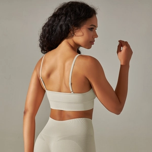 Light gray seamless yoga set with thin strap sports bra and high-waist leggings