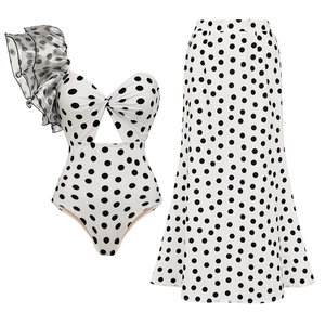 Vintage polka dot one-shoulder ruffled swimsuit with matching high-waist maxi skirt