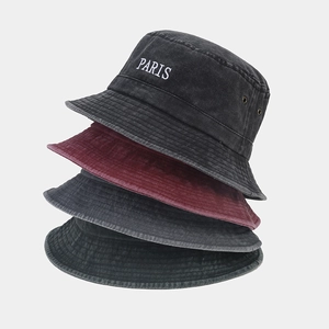 Stacked vintage washed cotton bucket hats featuring white PARIS letter embroidery detail