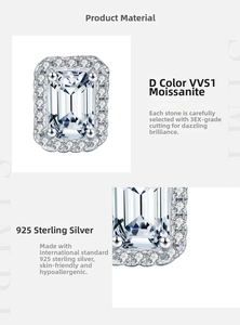 Detail of emerald cut moissanite earring in 925 sterling silver with halo setting