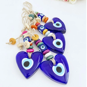 Blue heart evil eye glass pendants with colorful wooden beads on jute twine ropes
