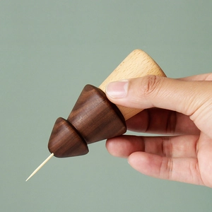 Japanese style walnut wood toothpick holder in pine cone shape with a unique two-tone design