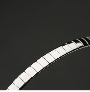 Detail showing the polished silver titanium steel links with a reflective metallic finish