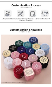 Detailed view of velvet ring boxes with custom gold foil letters and elegant textures
