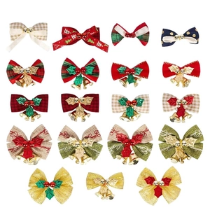 Detailed assortment of 16 decorative Christmas bows with bells and holly on white background
