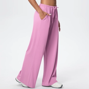 Detail view of pink wide-leg lounge pants showing drawstring waist and soft knit fabric