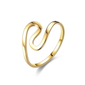 Macro shot of polished gold-plated stainless steel ring with wave S-curve fluid design