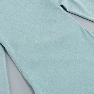 Detail of light blue knit fabric with metallic silver threads and premium seam craftsmanship