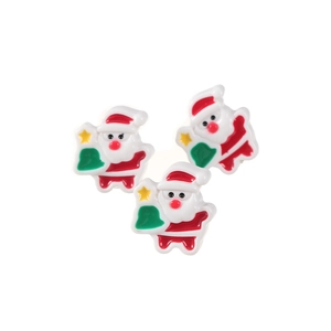 Set of three Santa Claus hair clips in red and white resin on a plain white background