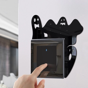 Ghost acrylic light switch decal for Halloween wall decor featuring a sleek black finish