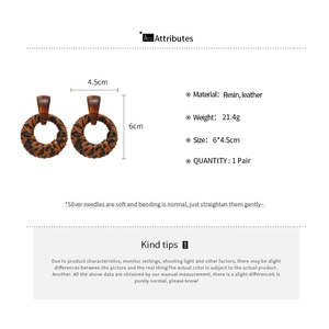 Detail view of leopard print resin earrings with dimensions and weight specifications