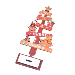 Decorative wooden desktop Christmas tree with festive holiday greeting and star topper