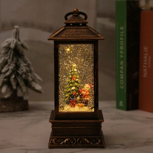 Vintage bronze Christmas lantern with swirling glitter and Santa scene in warm LED light