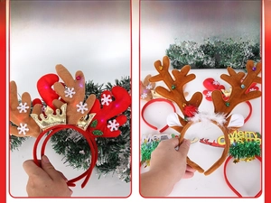 Detail of Christmas reindeer antler headband with LED lights, golden crown and small bells