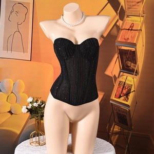 Detail of black slim-fit corset top with silver glitter stripes and structured bustier cup